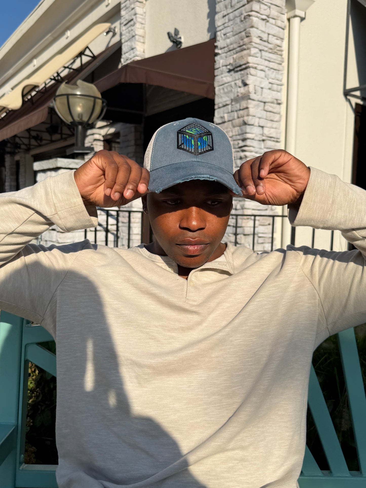EARTH IN A CAGE HAT